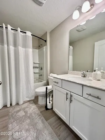 a view of a playground with basketball court