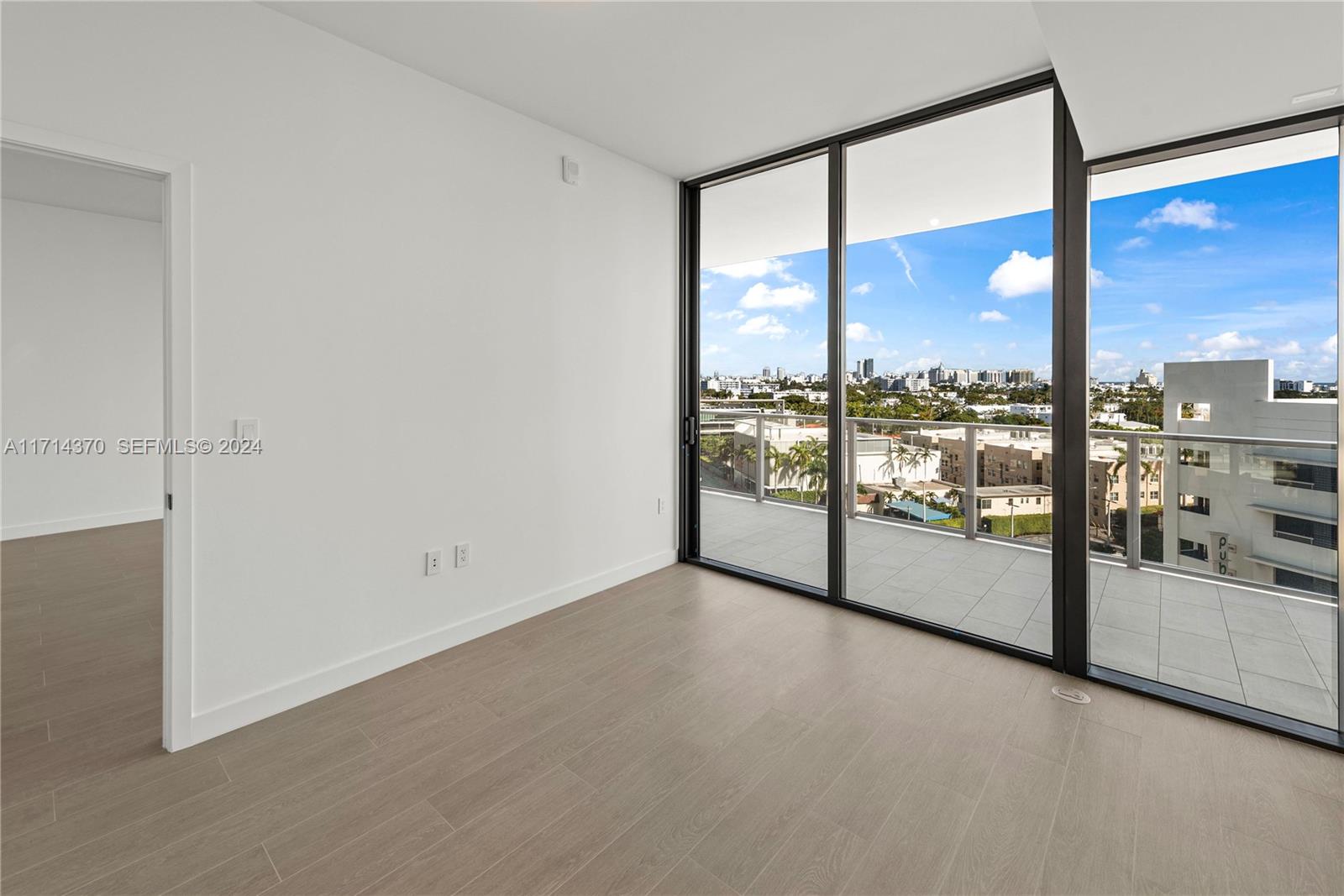 500 Alton Road, Unit 908 Miami Beach, FL 33139 - Photo 17 of 28 a view of a big room with large windows