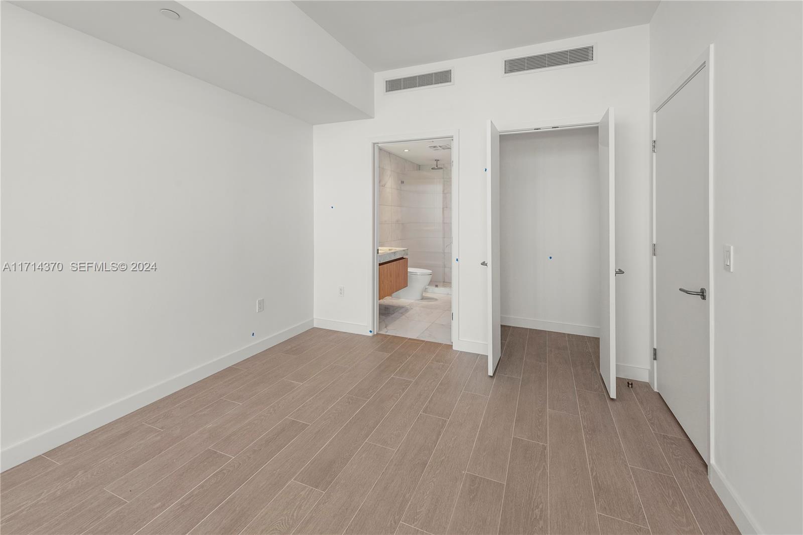 500 Alton Road, Unit 908 Miami Beach, FL 33139 - Photo 21 of 28 a view of a room with wooden floor and a window