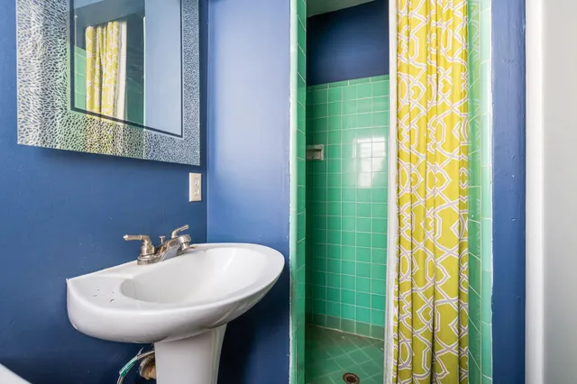 an empty room with closet and windows