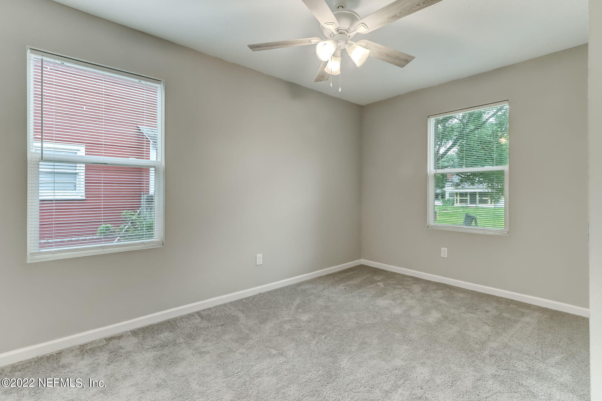 5218 Sunderland Road Jacksonville, FL 32210 - Photo 15 of 23 a view of an empty room with a window
