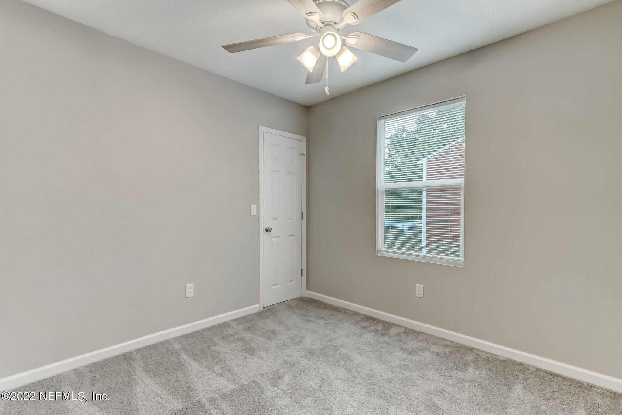 5218 Sunderland Road Jacksonville, FL 32210 - Photo 19 of 23 an empty room with a window