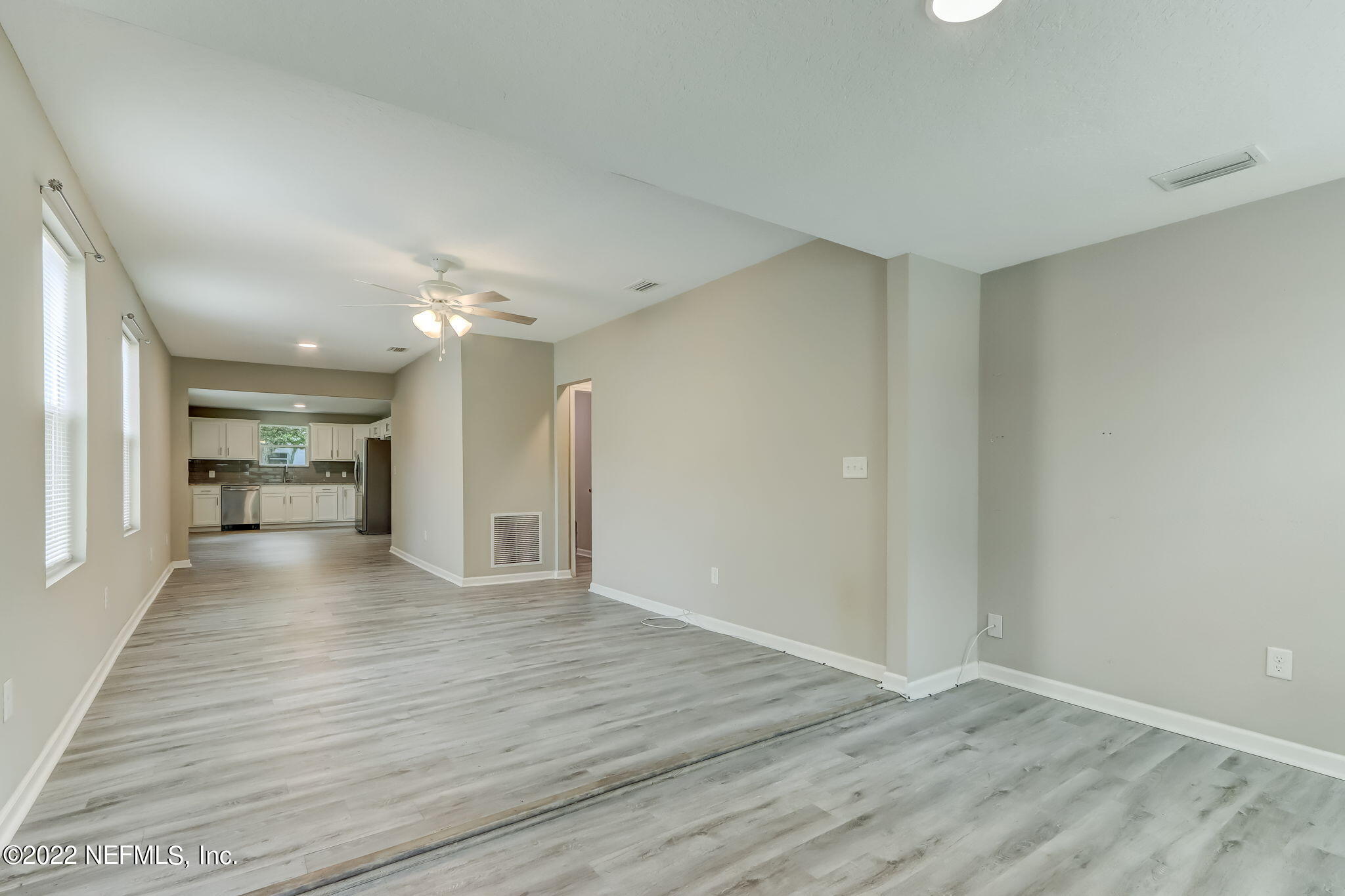 5218 Sunderland Road Jacksonville, FL 32210 - Photo 3 of 23 a view of a hallway with wooden floor