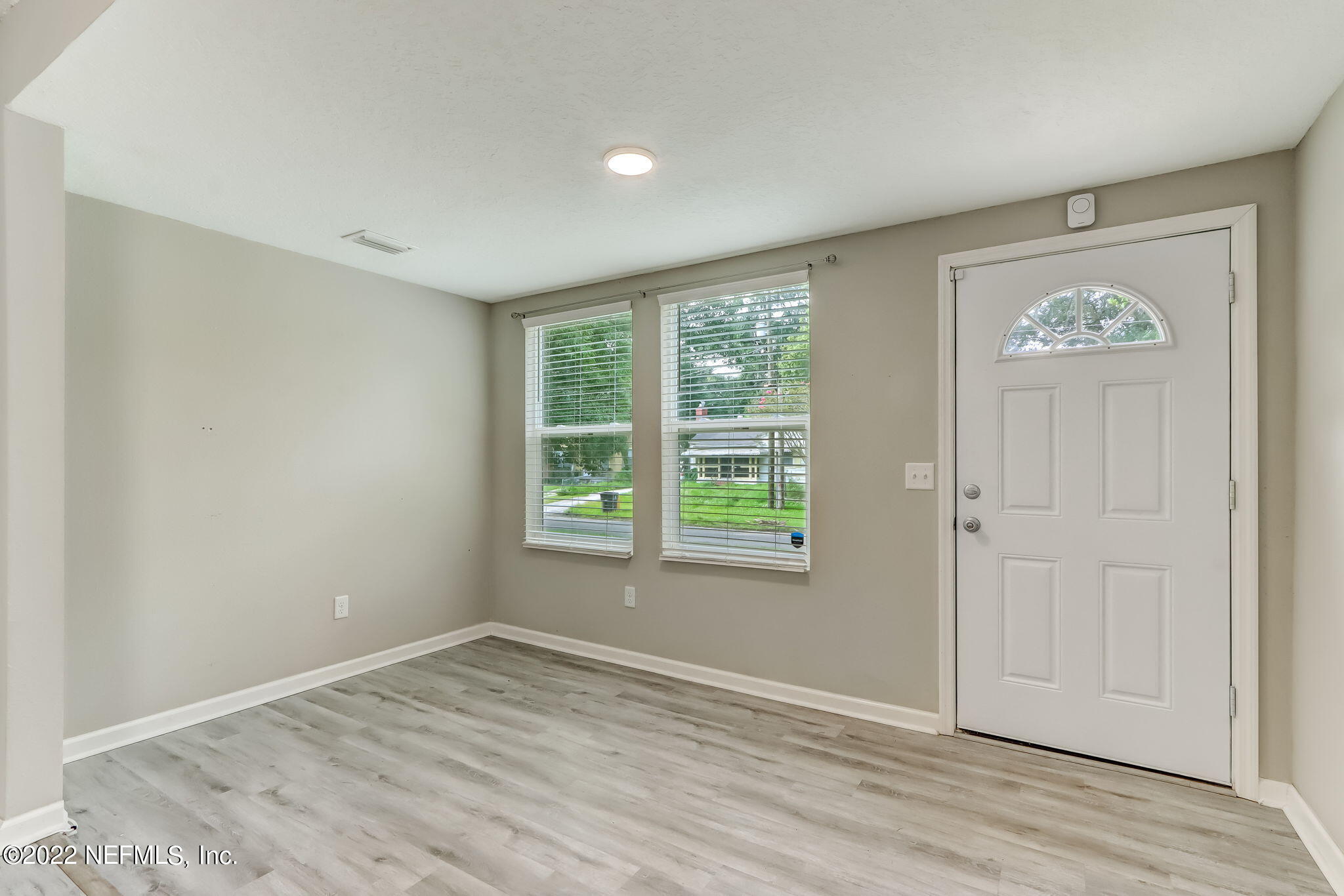 5218 Sunderland Road Jacksonville, FL 32210 - Photo 4 of 23 an empty room with a window