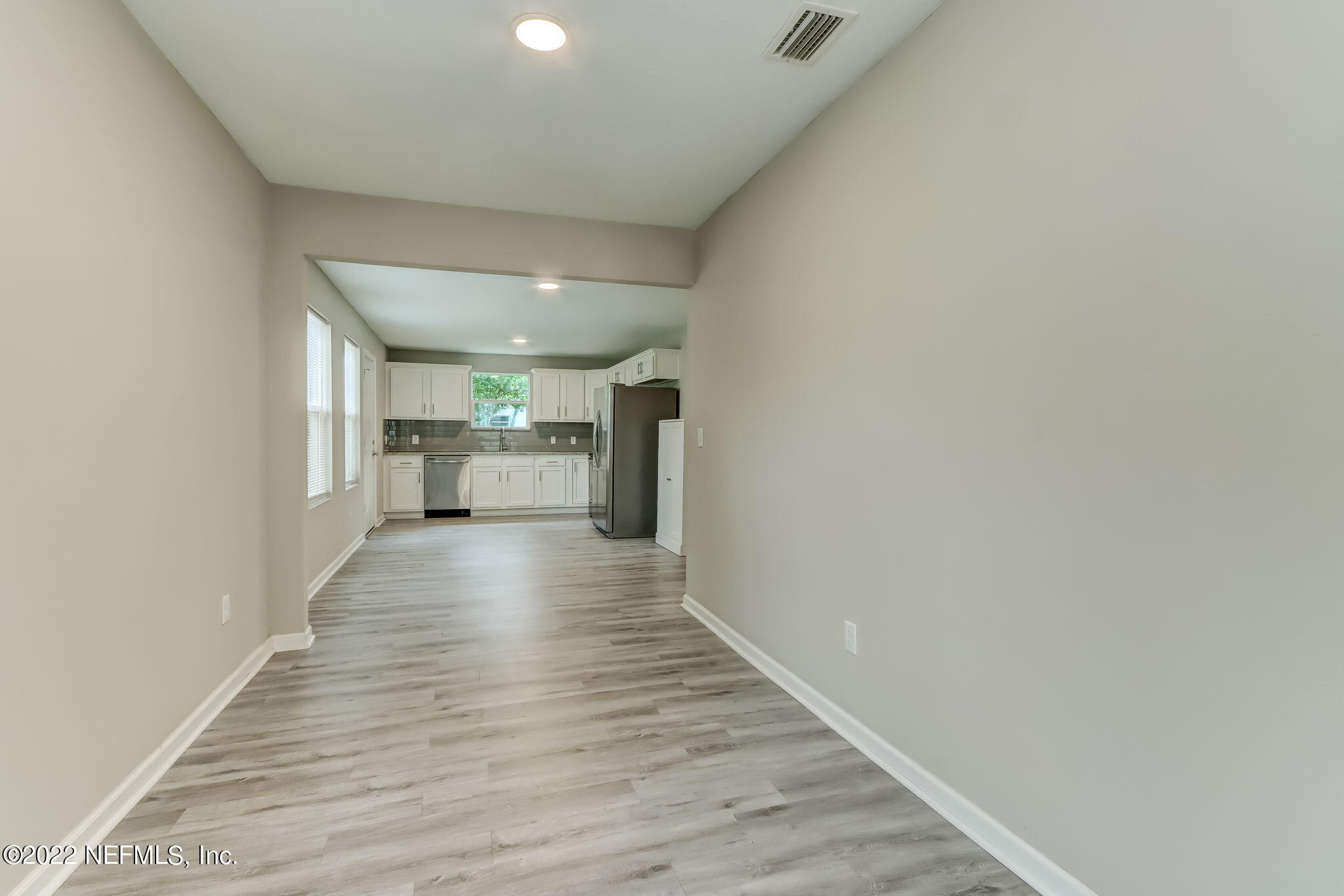 5218 Sunderland Road Jacksonville, FL 32210 - Photo 5 of 23 a view of a hallway with wooden floor