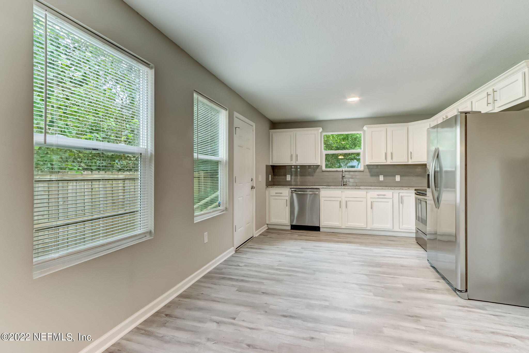 5218 Sunderland Road Jacksonville, FL 32210 - Photo 6 of 23 a kitchen with stainless steel appliances granite countertop a refrigerator and a stove top oven