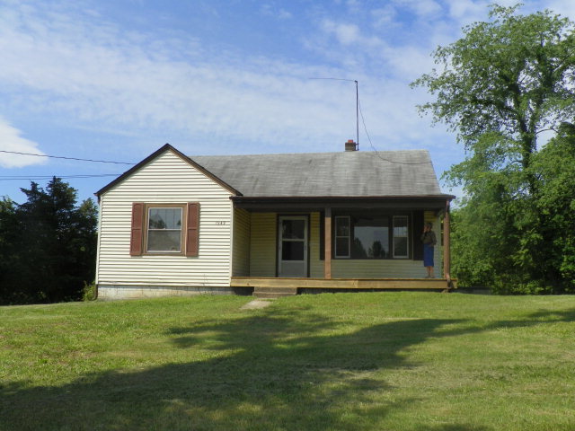 1949 The Great Road Fieldale, VA 24089 - Photo 1 of 6 a front view of house with a garden
