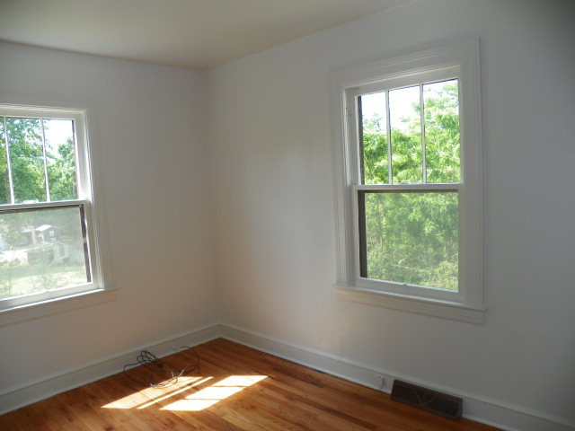 1949 The Great Road Fieldale, VA 24089 - Photo 4 of 6 an empty room with wooden floor and windows
