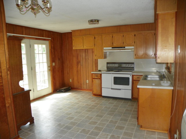 1949 The Great Road Fieldale, VA 24089 - Photo 5 of 6 a kitchen with stainless steel appliances a stove a microwave and a refrigerator