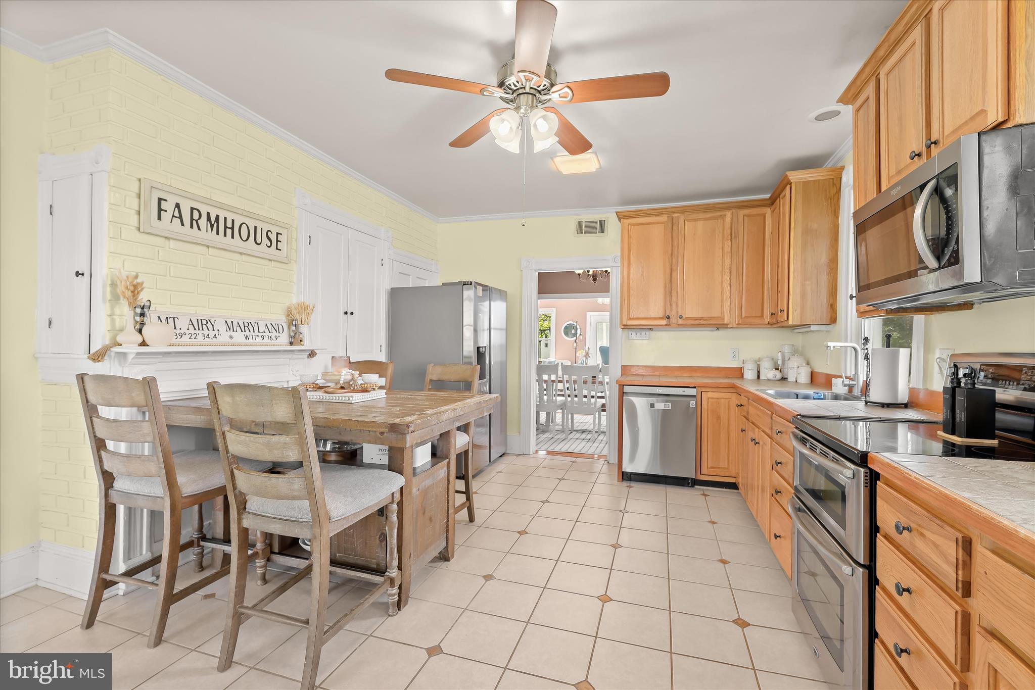 13041 Penn Shop Road Mount Airy, MD 21771 - Photo 11 of 57 a kitchen with stainless steel appliances kitchen island granite countertop a sink and cabinets