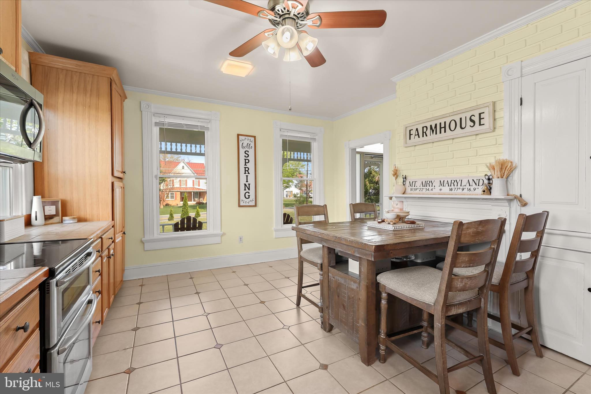 13041 Penn Shop Road Mount Airy, MD 21771 - Photo 12 of 57 a view of a dining room with furniture and a chandelier fan