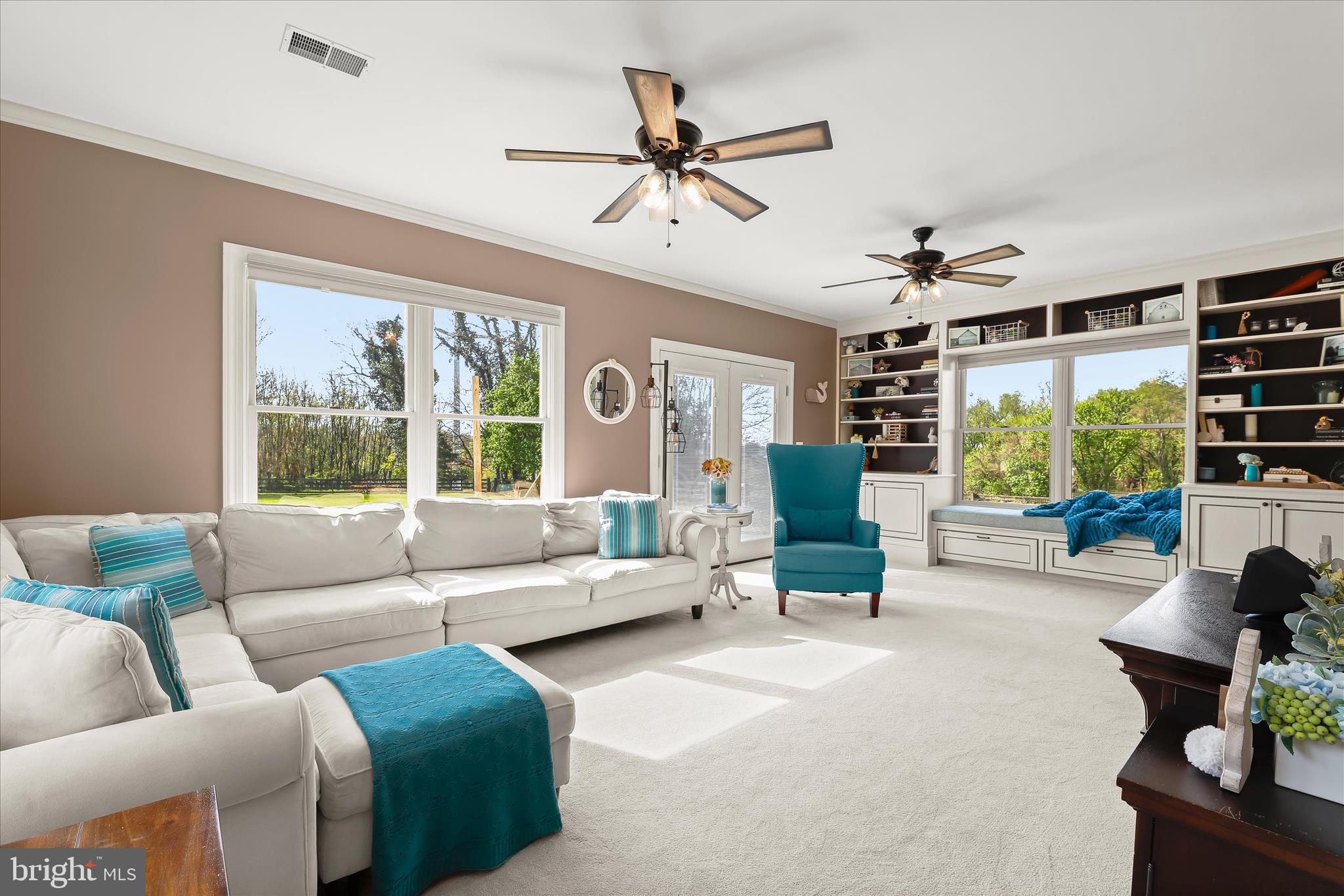 13041 Penn Shop Road Mount Airy, MD 21771 - Photo 18 of 57 a living room with furniture ceiling fan and a large window