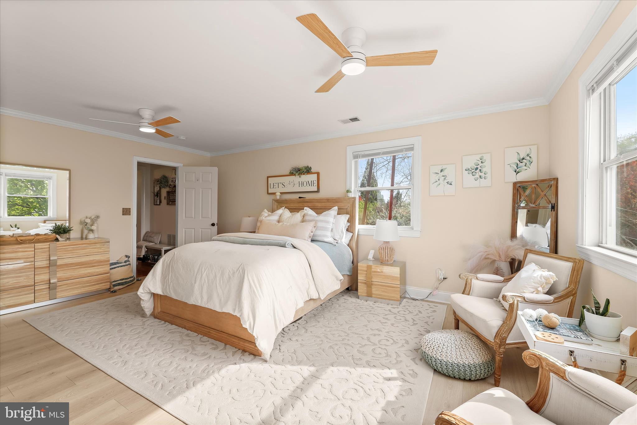 13041 Penn Shop Road Mount Airy, MD 21771 - Photo 28 of 57 a spacious bedroom with a bed and glass walk in closet