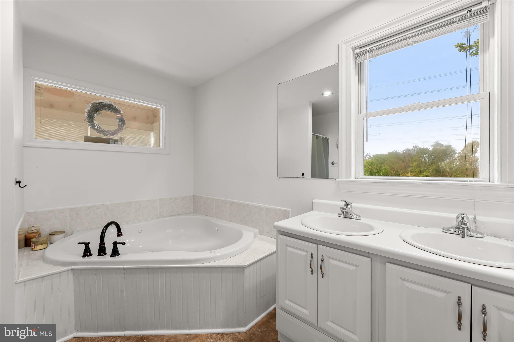 13041 Penn Shop Road Mount Airy, MD 21771 - Photo 30 of 57 a bathroom with a sink and a bathtub