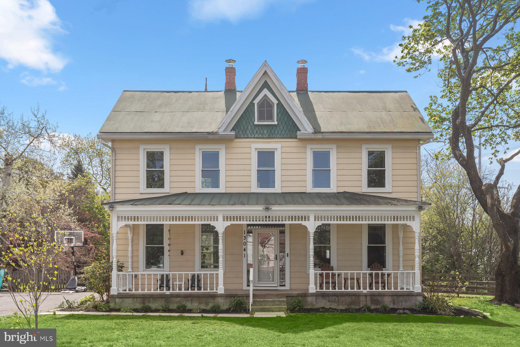 13041 Penn Shop Road Mount Airy, MD 21771 - Photo 3 of 57 a view of a brick house with a yard