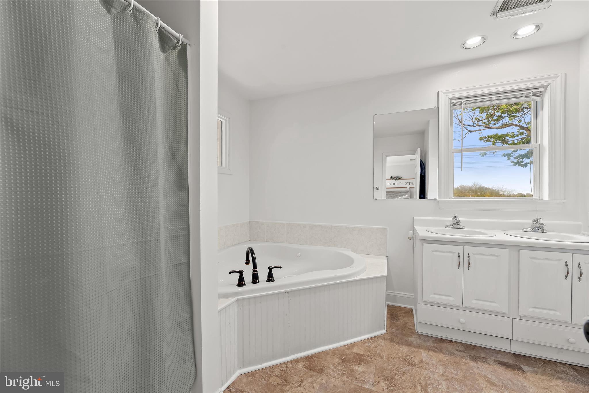 13041 Penn Shop Road Mount Airy, MD 21771 - Photo 31 of 57 a white bath tub sitting next to a white sink