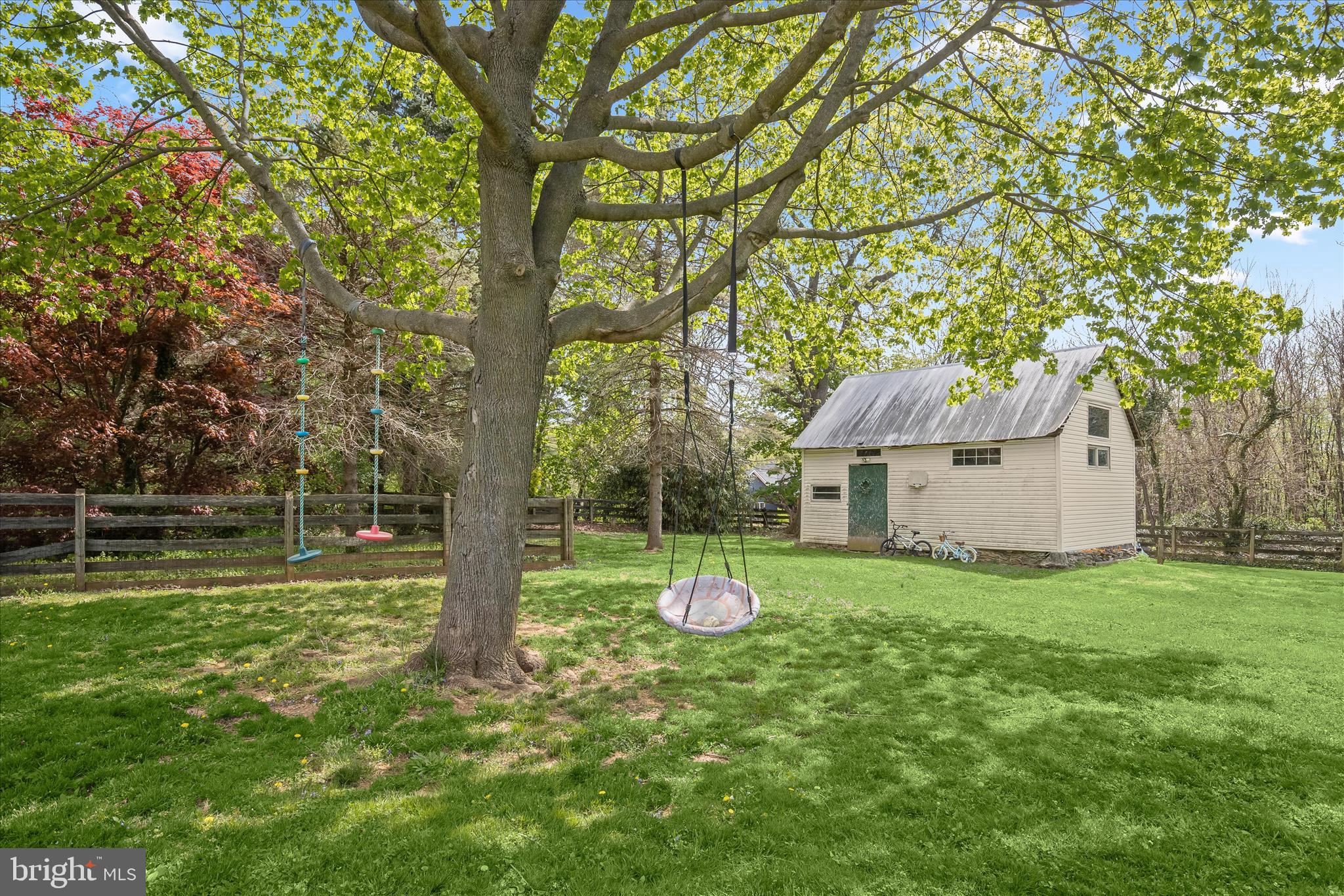 13041 Penn Shop Road Mount Airy, MD 21771 - Photo 44 of 57 a backyard of a house with plants and large tree