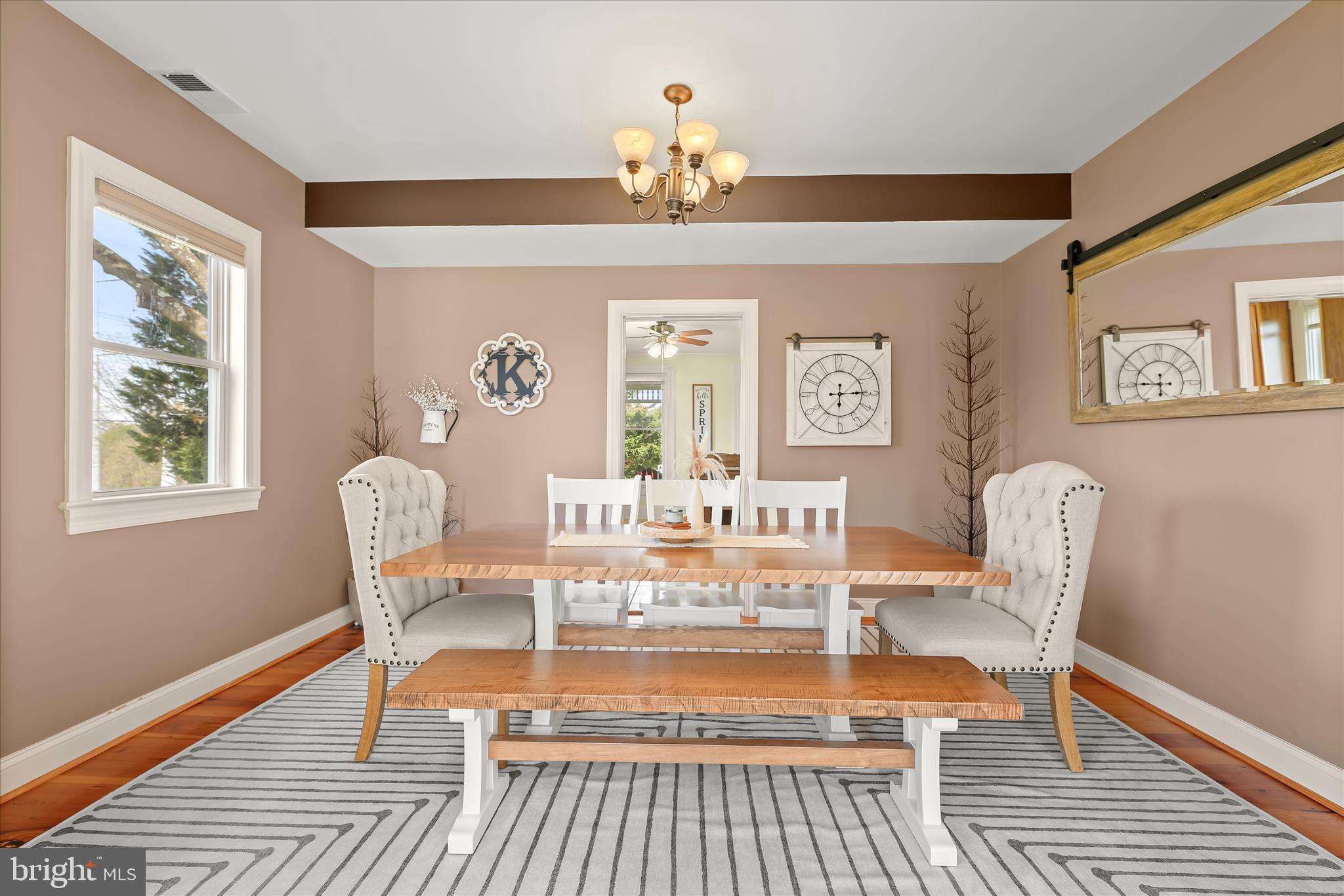 13041 Penn Shop Road Mount Airy, MD 21771 - Photo 6 of 57 a view of a dining room with furniture a chandelier and wooden floor