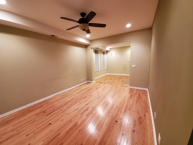 3610 South Seeley Avenue Chicago, IL 60609 - Photo 12 of 26 a view of empty room with wooden floor