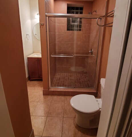 3610 South Seeley Avenue Chicago, IL 60609 - Photo 17 of 26 a bathroom with a toilet and a shower