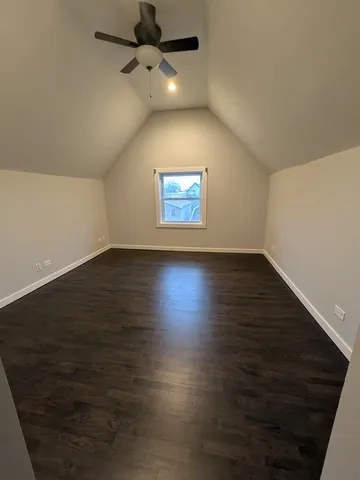 a view of room with wooden floor