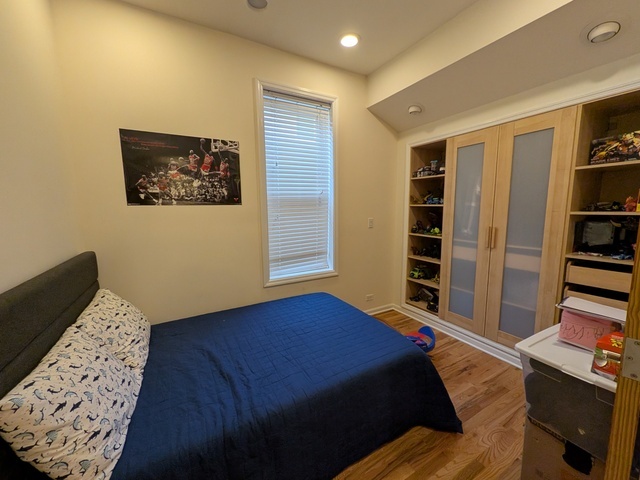 3610 South Seeley Avenue Chicago, IL 60609 - Photo 6 of 26 a bedroom with a bed and a television