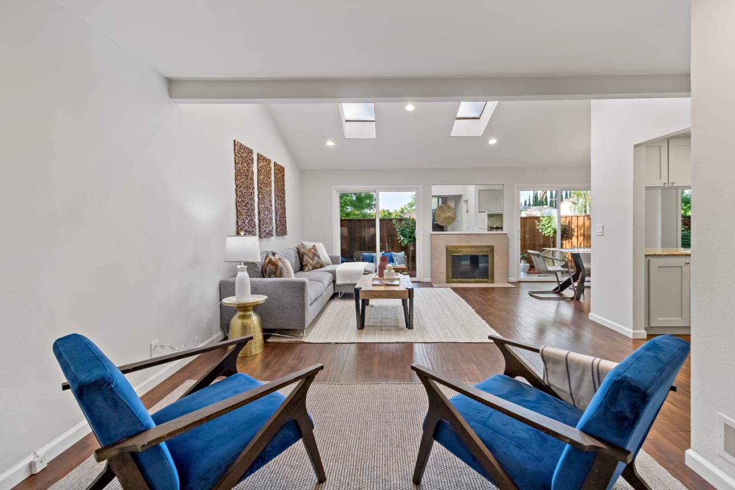 20179 NW Square Cupertino, CA 95014 - Photo 12 of 50 a view of a dining room with furniture and a fireplace