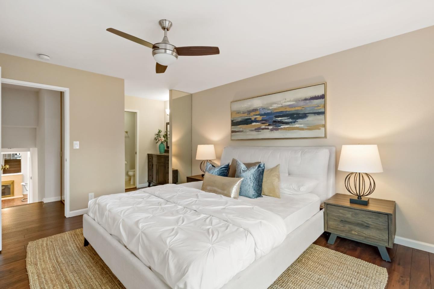 20179 NW Square Cupertino, CA 95014 - Photo 19 of 50 a bedroom with a large bed and a chandelier