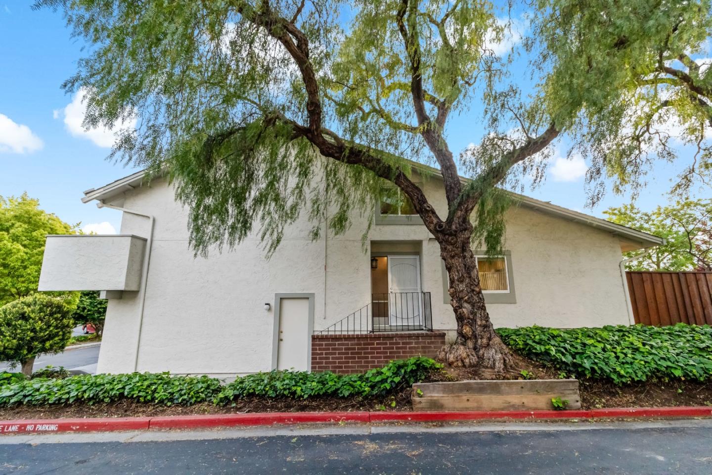 20179 NW Square Cupertino, CA 95014 - Photo 3 of 50 front view of a house with a yard and an trees
