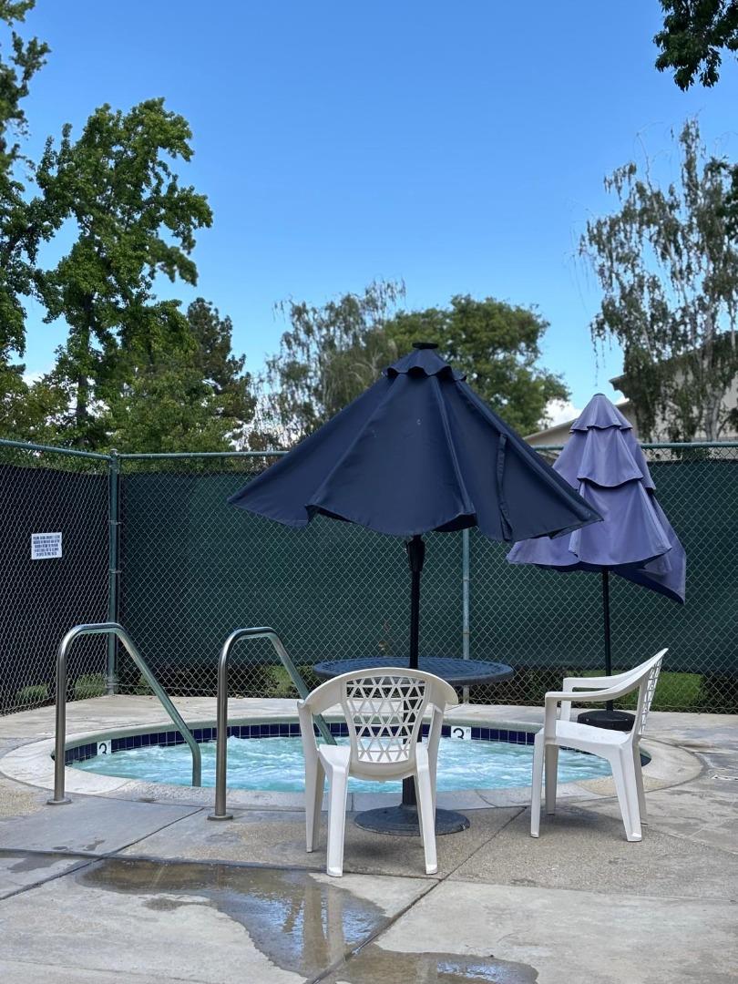 20179 NW Square Cupertino, CA 95014 - Photo 38 of 50 a backyard of a house with table and chairs