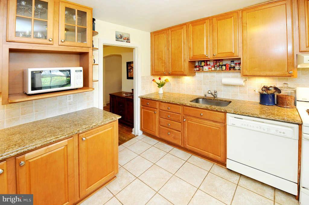 4523 Sleaford Road Bethesda, MD 20814 - Photo 2 of 23 a kitchen with stainless steel appliances granite countertop a sink and cabinets