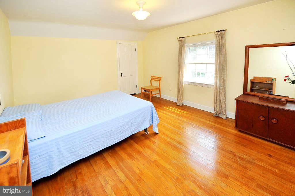 4523 Sleaford Road Bethesda, MD 20814 - Photo 12 of 23 a bedroom with a bed and a dresser
