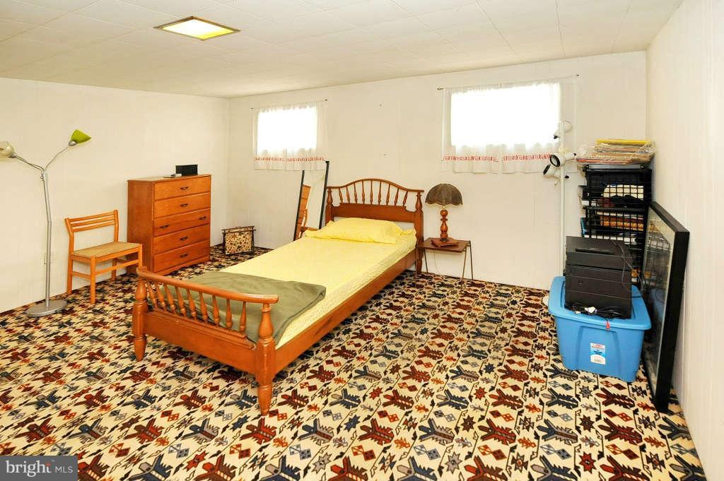 4523 Sleaford Road Bethesda, MD 20814 - Photo 15 of 23 a bedroom with a bed and wooden floor