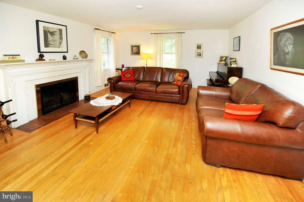 4523 Sleaford Road Bethesda, MD 20814 - Photo 4 of 23 a living room with furniture and a fireplace