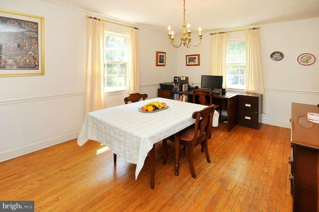 4523 Sleaford Road Bethesda, MD 20814 - Photo 6 of 23 a view of a dining room with furniture and wooden floor