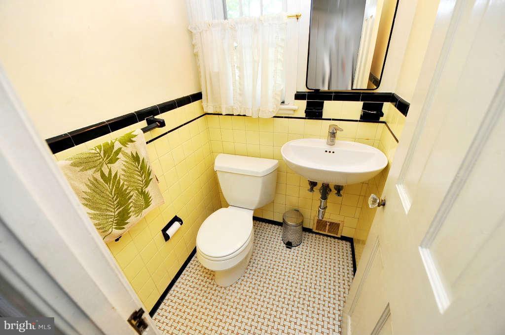 4523 Sleaford Road Bethesda, MD 20814 - Photo 7 of 23 a bathroom with a sink and a mirror