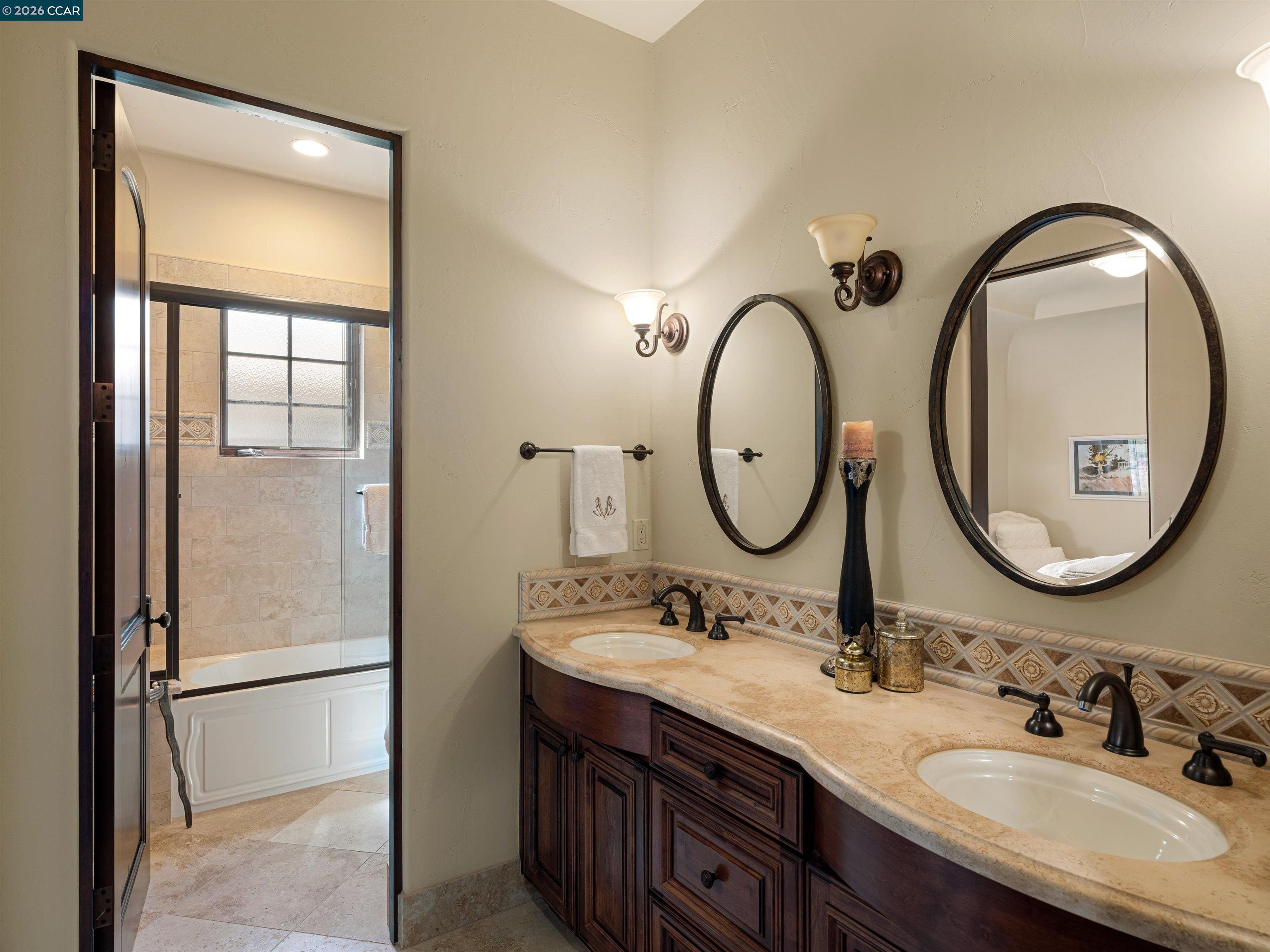 2020 Victorine Road Livermore, CA 94551 - Photo 51 of 99 a bathroom with a double vanity sink and a mirror