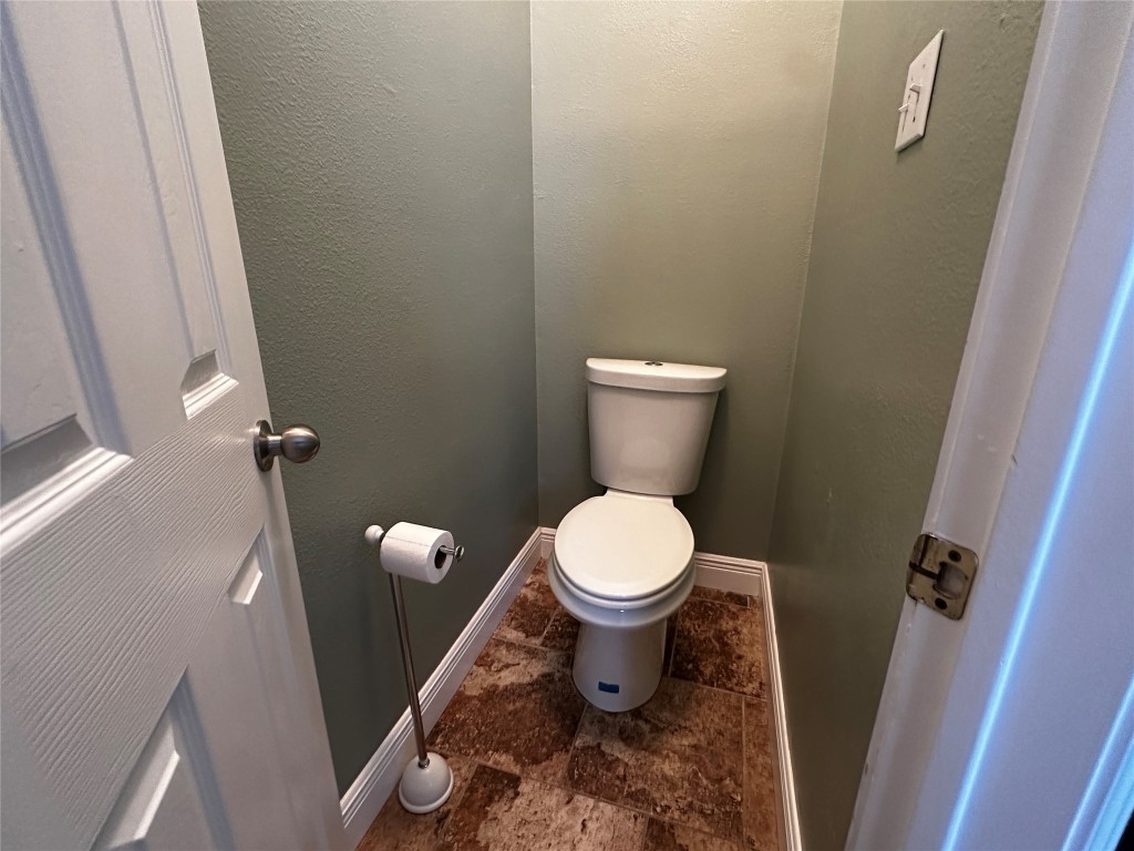 1041 Disraeli Circle Pflugerville, TX 78660 - Photo 22 of 29 a bathroom with a toilet and a sink