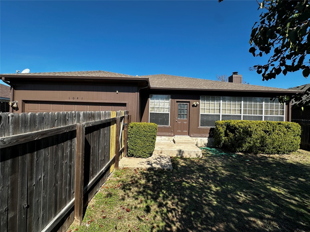 1041 Disraeli Circle Pflugerville, TX 78660 - Photo 4 of 29 a front view of a house with garden