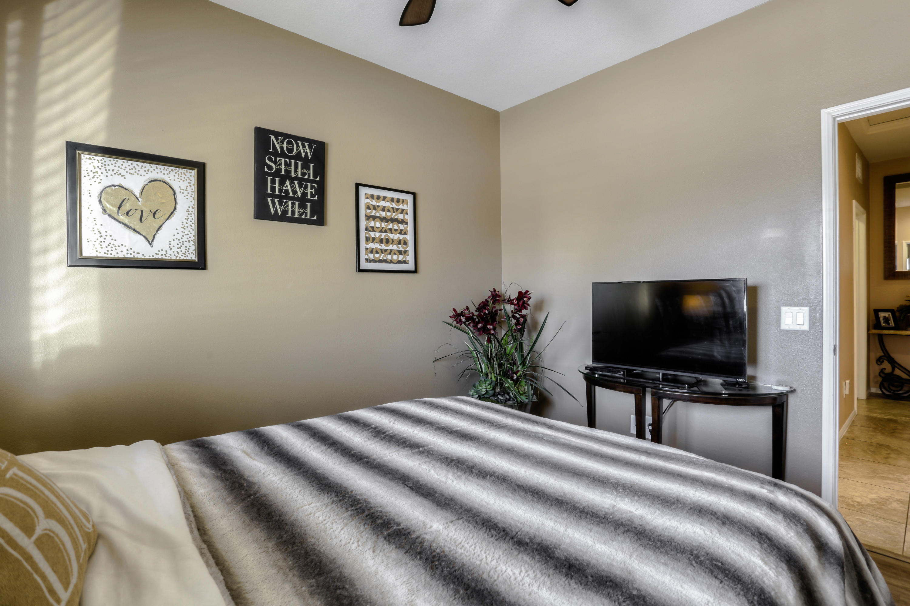 35880 Raphael Drive Palm Desert, CA 92211 - Photo 15 of 28 a bedroom with a bed and a flat screen tv