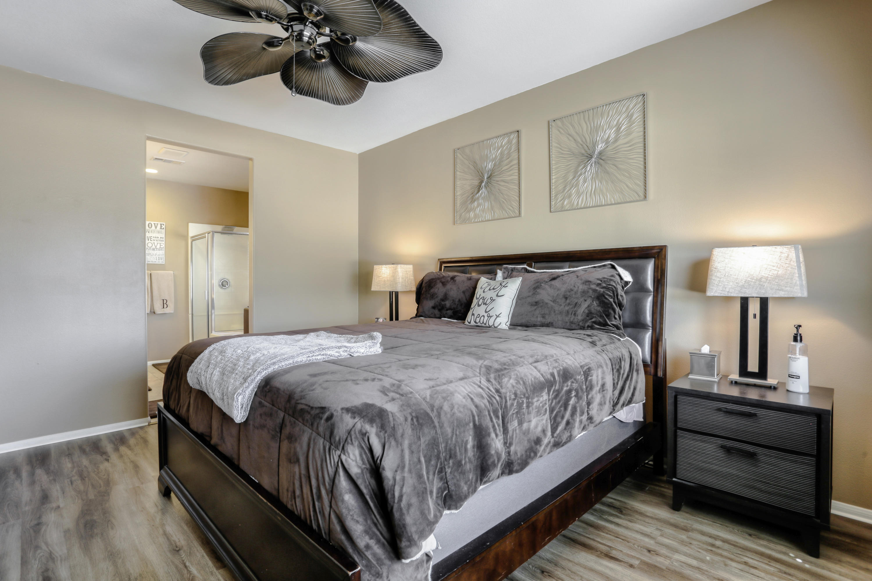 35880 Raphael Drive Palm Desert, CA 92211 - Photo 17 of 28 a bedroom with a bed and wooden floor