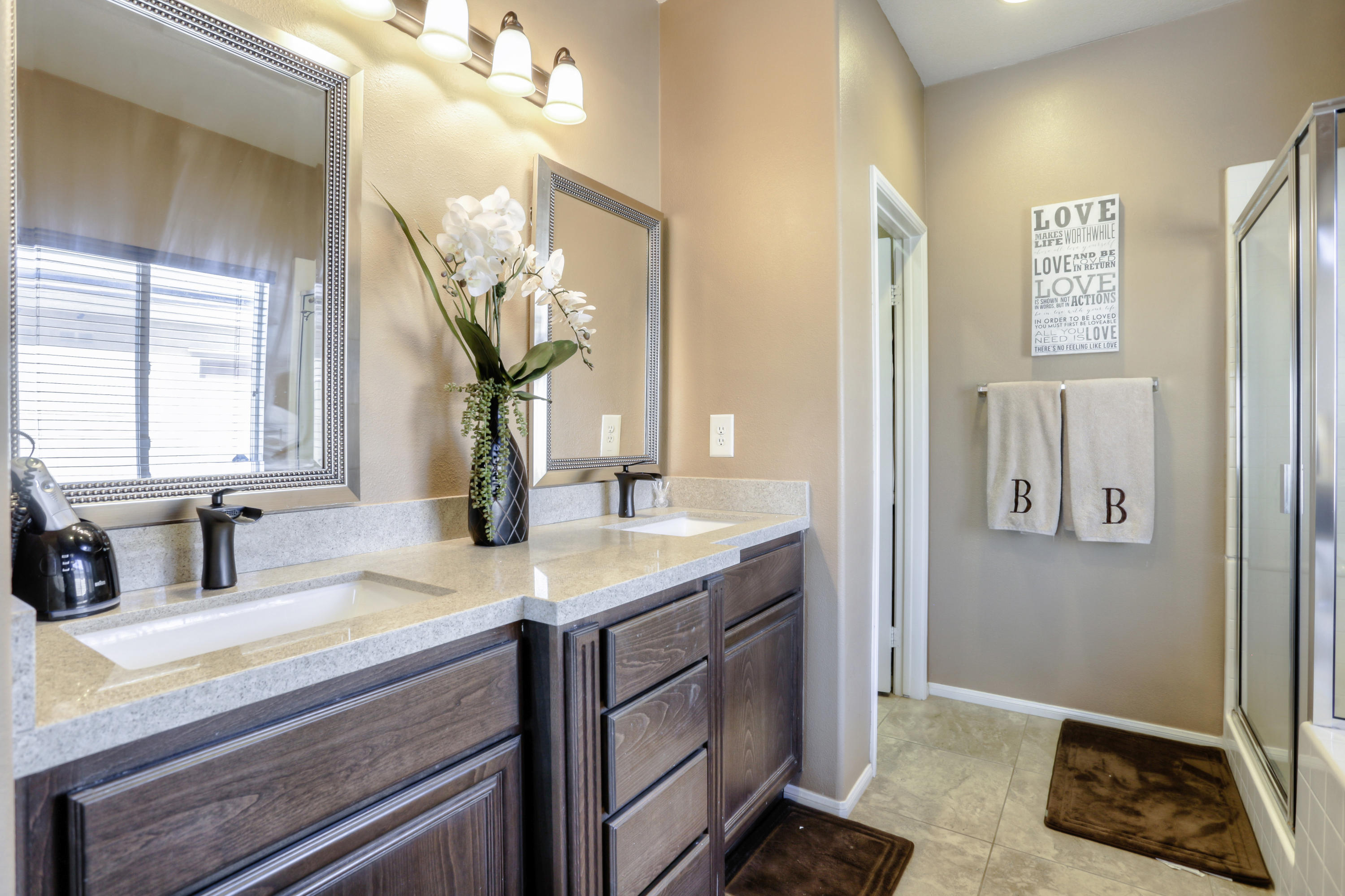 35880 Raphael Drive Palm Desert, CA 92211 - Photo 19 of 28 a bathroom with a sink a vanity and a mirror