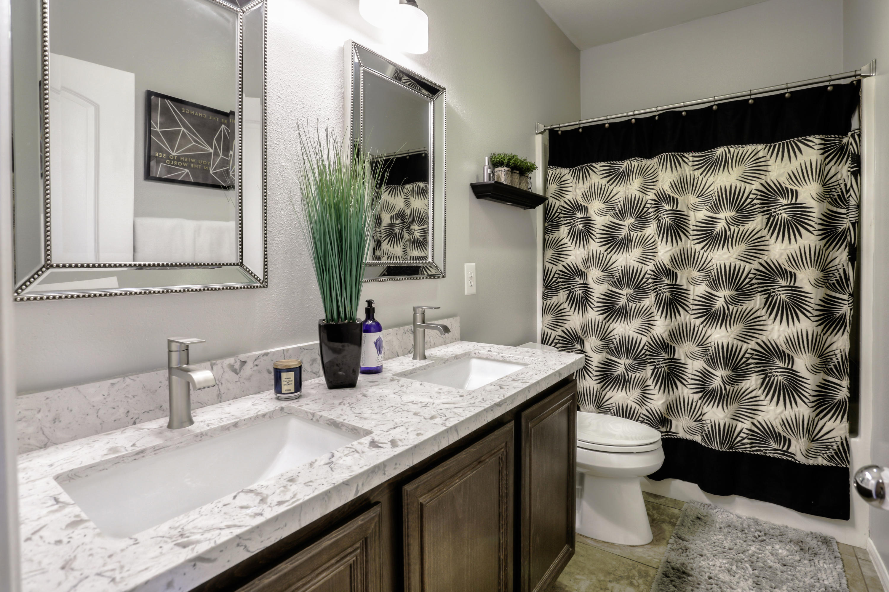 35880 Raphael Drive Palm Desert, CA 92211 - Photo 22 of 28 a bathroom with a granite countertop sink and a mirror