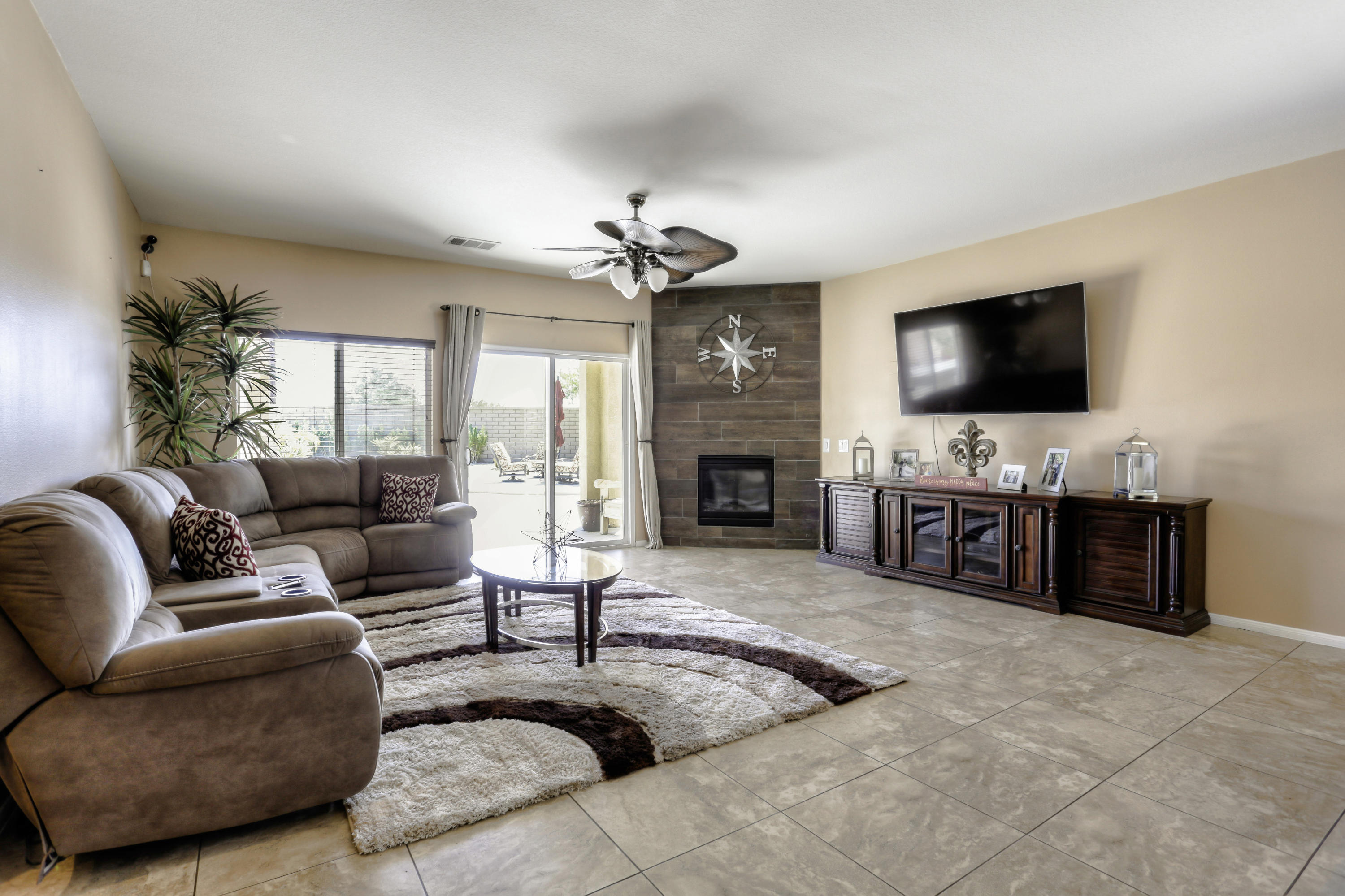 35880 Raphael Drive Palm Desert, CA 92211 - Photo 4 of 28 a living room with furniture flat screen tv and a fireplace