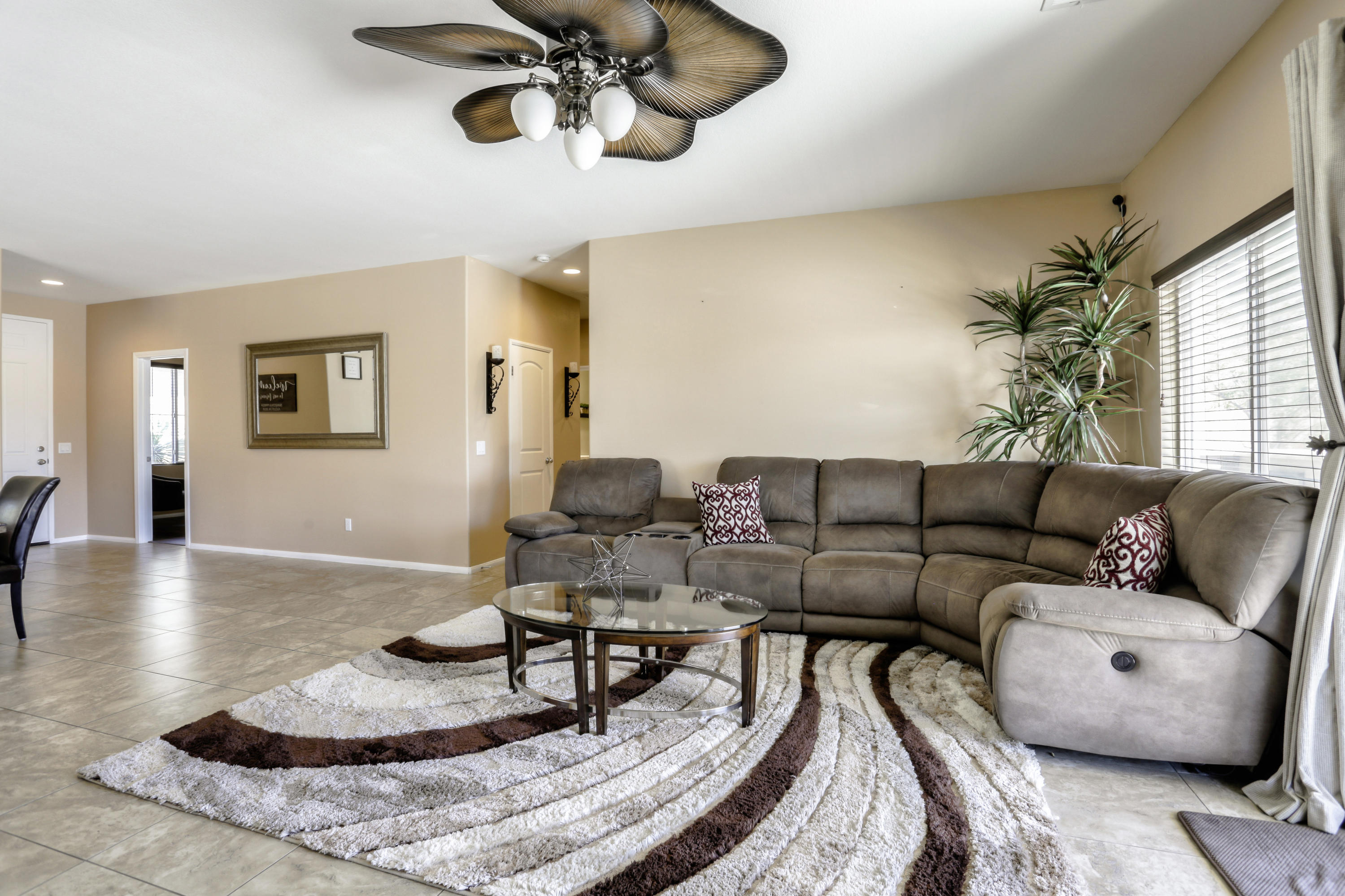 35880 Raphael Drive Palm Desert, CA 92211 - Photo 6 of 28 a living room with furniture and a chandelier