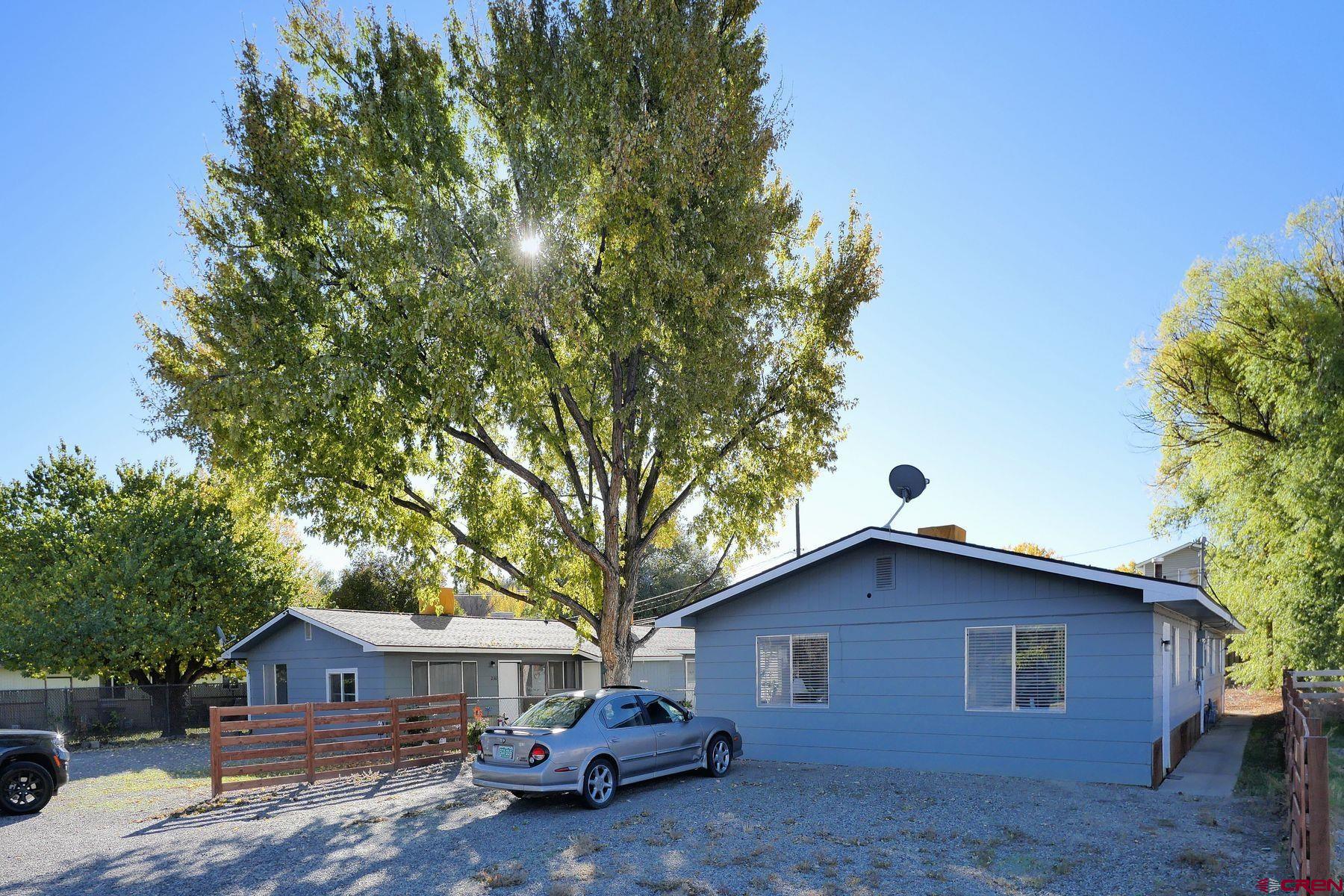 240 Short Street Delta, CO 81416 - Photo 8 of 14 a front view of a house with a garden
