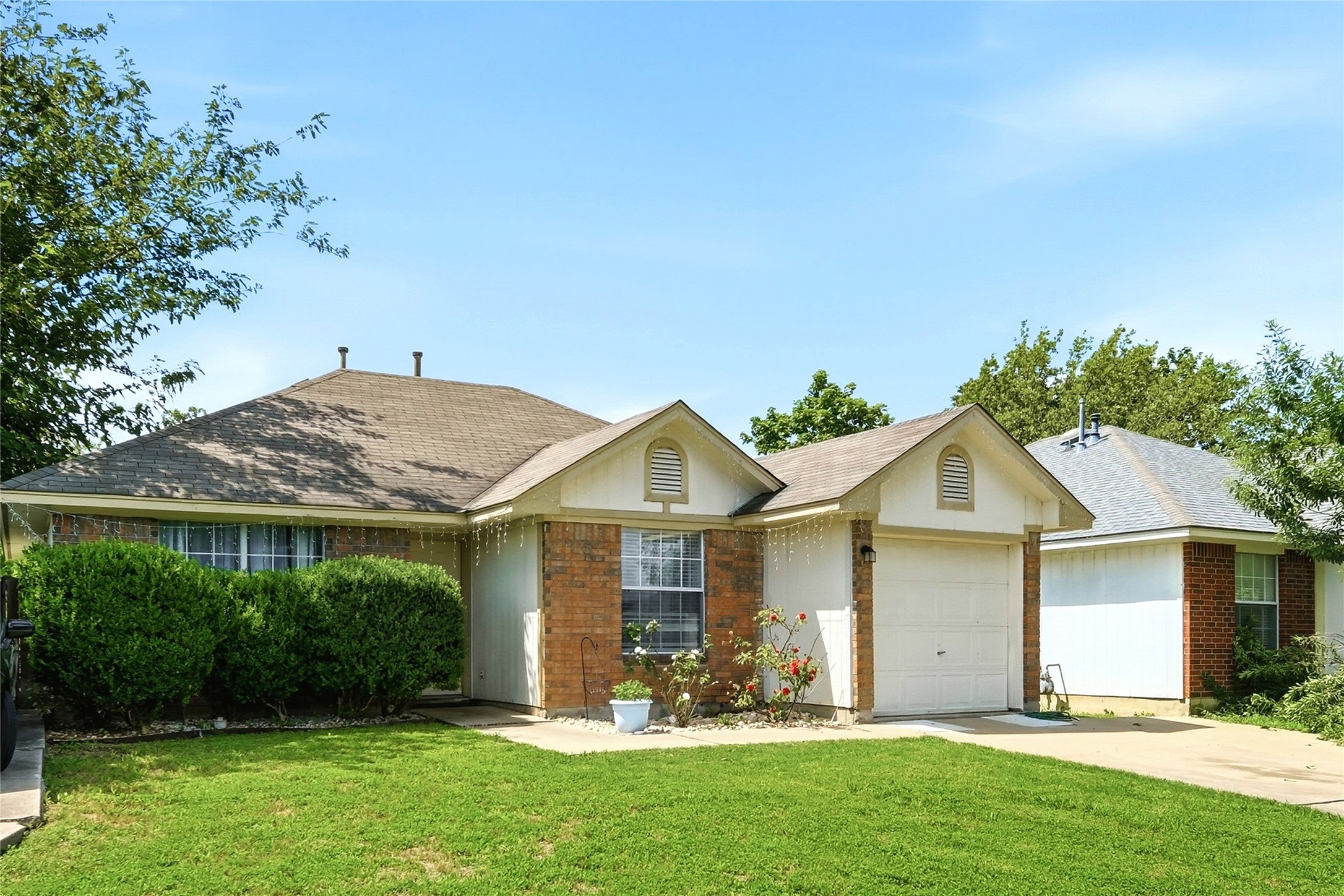 310 Raintree Drive Georgetown, TX 78626 - Photo 1 of 12 A classic brick and siding home with a welcoming front lawn and neatly trimmed shrubbery.