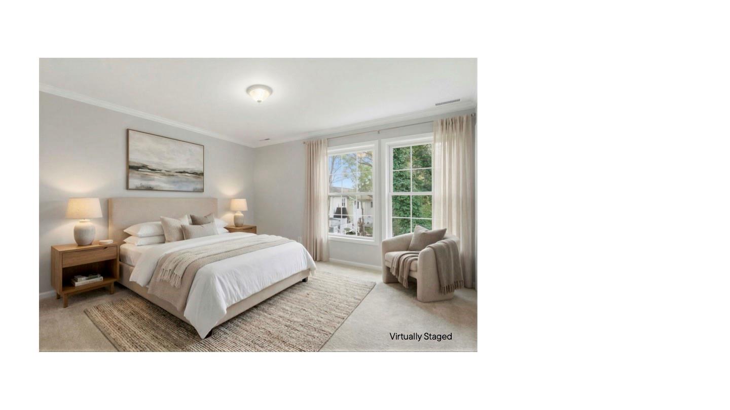 7019 Walnut Ridge Court Charlotte, NC 28273 - Photo 12 of 30 a living room with a bed couches and a large window