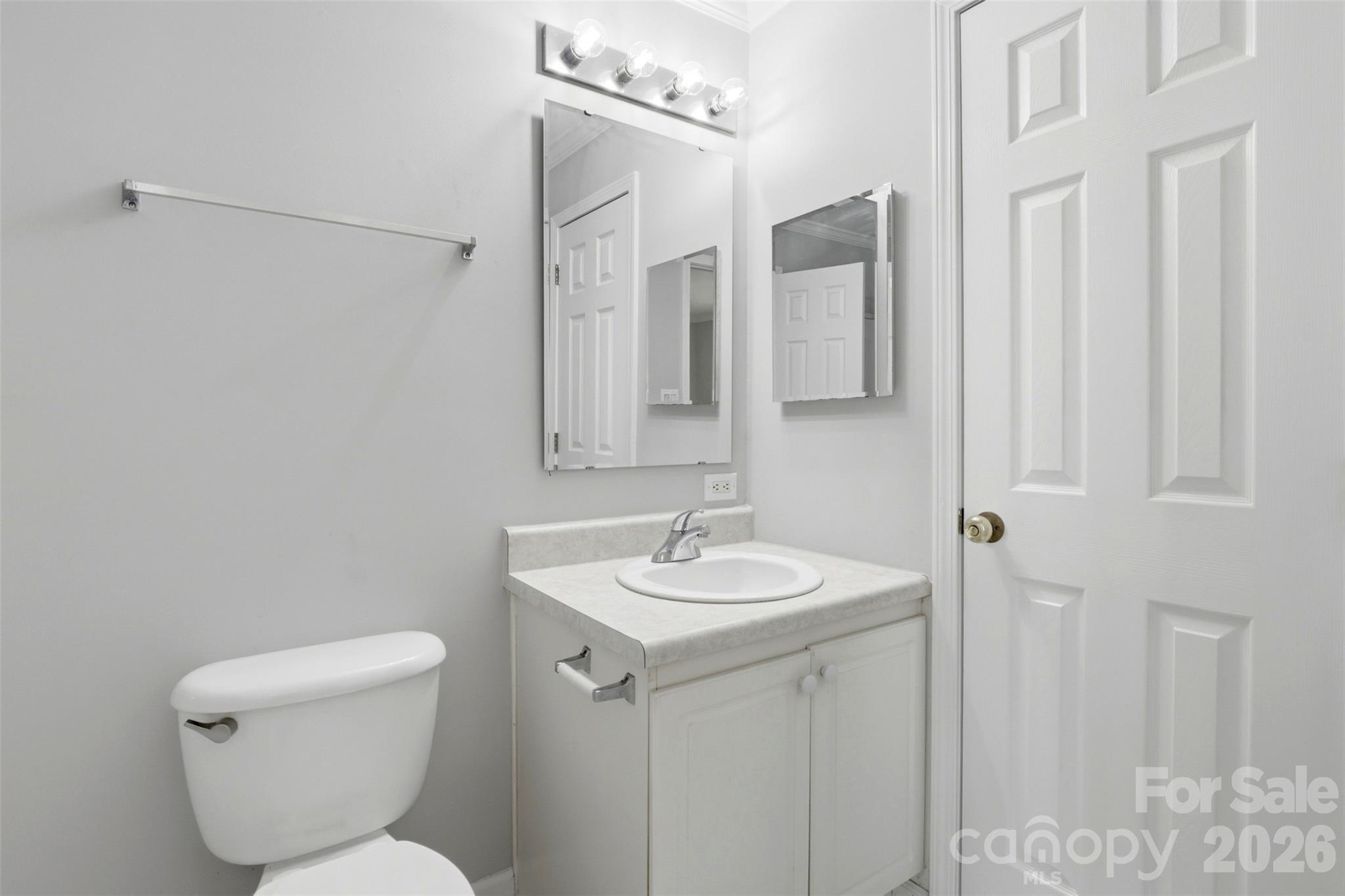 7019 Walnut Ridge Court Charlotte, NC 28273 - Photo 15 of 30 a bathroom with a toilet sink and mirror