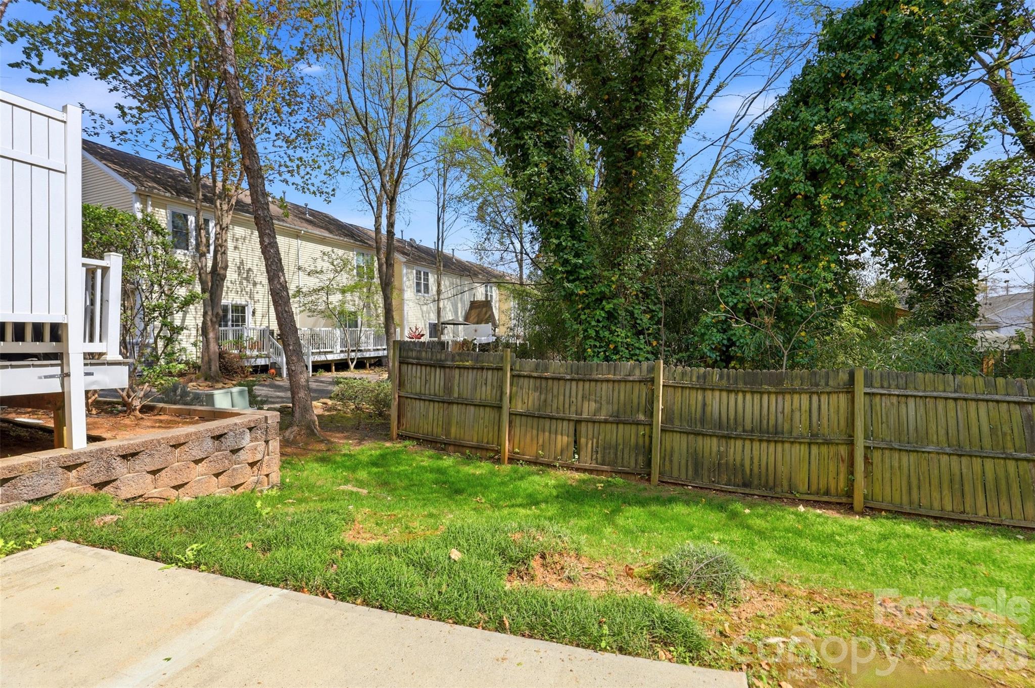 7019 Walnut Ridge Court Charlotte, NC 28273 - Photo 25 of 30 a view of a backyard with a large tree
